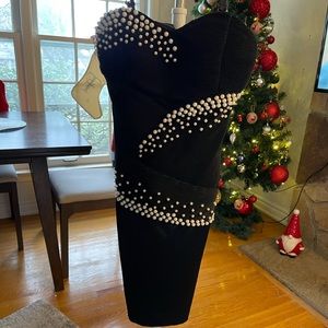 Perfect condition party dress. Never worn. Black color with pearls. Small size.